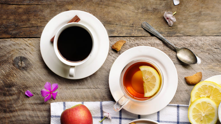 Overhead view of tea break food and drink table top image.