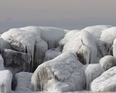 Ludington Michigan's Light with ice covered rocks in the foreground